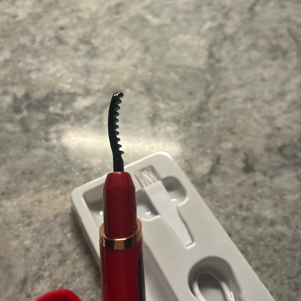 Red Eyelash Curler with Gold Accents